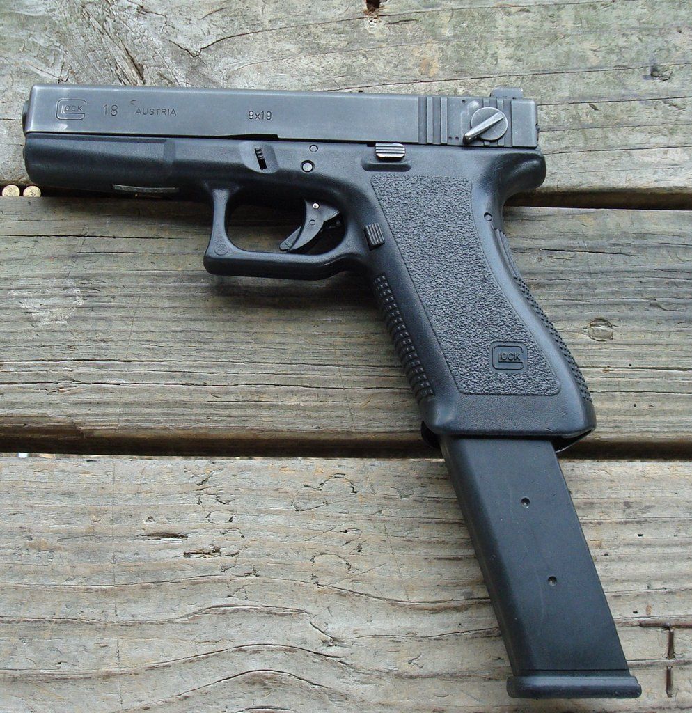 Glock 18 with extended clip.